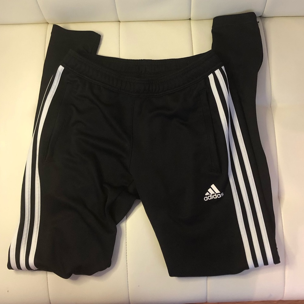 Adidas women’s track pants size XS.   Zippers at the ankles and zipper pockets.